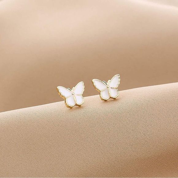 Jewelry - Tiny Petite beautiful pearl-colored butterfly earrings.